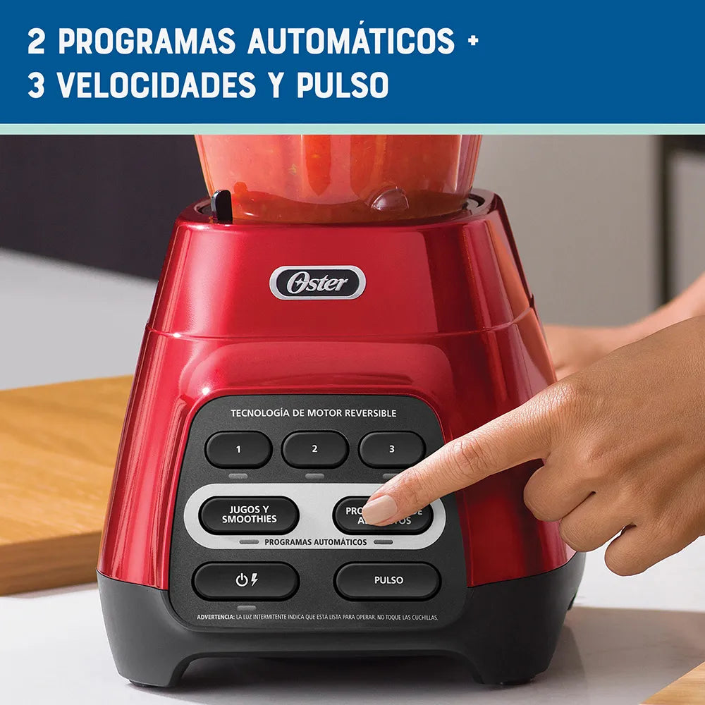 Licuadora roja con programas automáticos, tecnología reversible y vaso Blend