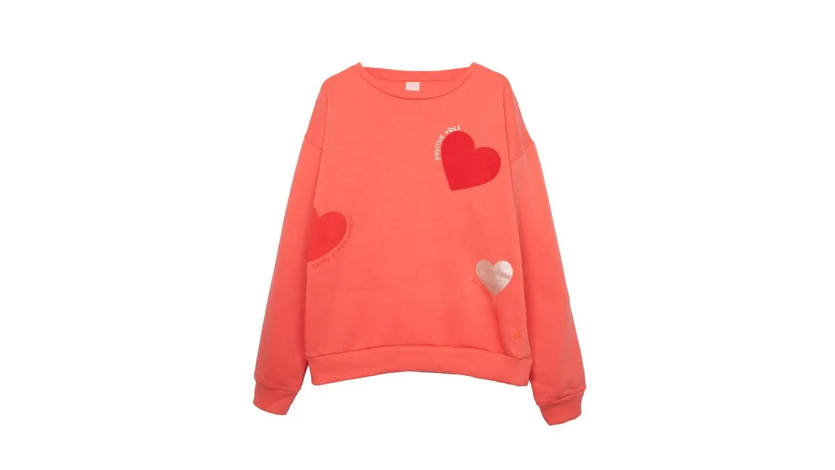 Polerón Niña Cuello Redondo Estampado Corazones Naranjo