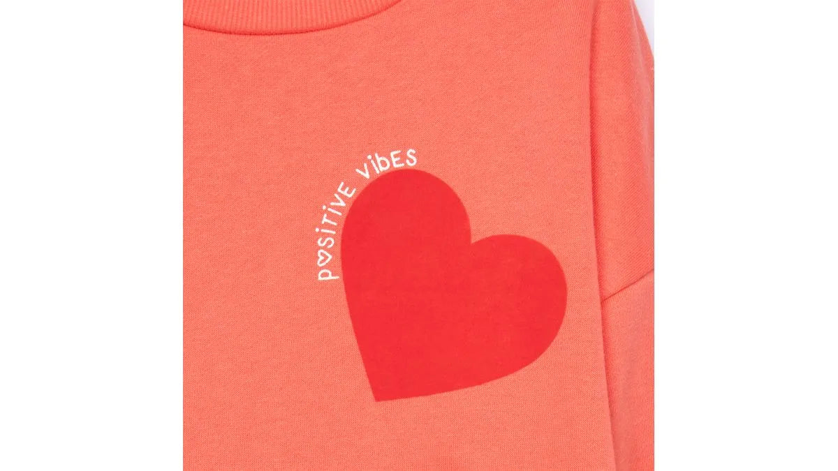 Polerón Niña Cuello Redondo Estampado Corazones Naranjo