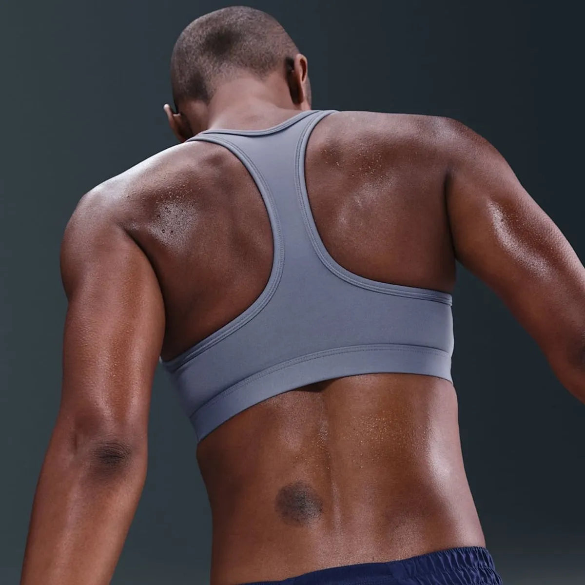 Peto Mujer Swoosh Medium Support Violeta